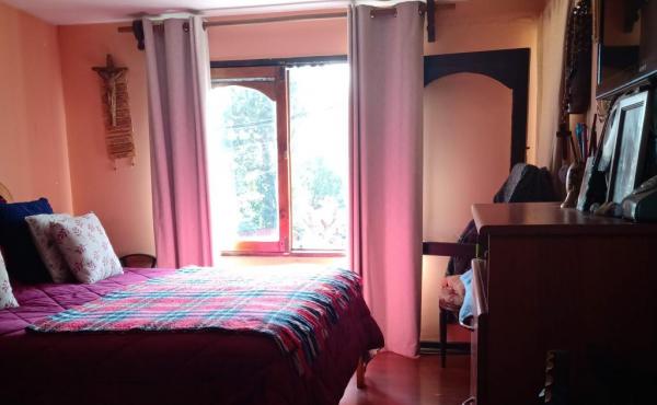 dormitorio principal con baño en suite, planta baja